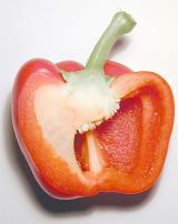 Halved healthy red bell pepper or sweet pepper, a member of the capsicum family, rich in vitamins and antioxidants