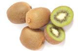 Fresh exotic tropical kiwi fruit, halved and whole showing the texture of the pulp and pattern of the pips, on a white background