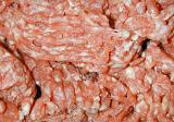 Background texture of raw uncooked mince meat with specks of fat ready for using as an ingredient in cooking