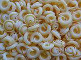 Background texture of dried coiled pasta made from durum wheat and eggs for use in Italian cuisine