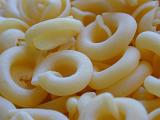 Background texture of dried round Italian pasta noodles made from durum wheat dough and a rich source of carbohydrate