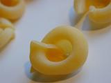 Closeup of dried uncooked Italian pasta made from eggs and durum wheat dough for use as an ingredient in traditional Italian and Mediterranean cooking