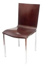 Modern molded brown chair with metal legs isolated on a white background