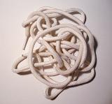 High Angle Jumble of Tangled White Shoe Laces on White Background