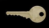Panoramic Image of Isolated Gold Colored Key with Round Head on Black Background