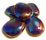 Five smooth iridescent stones with a colourful sheen used as an ornament for interior decor or as massage stones for s spa, on a white background