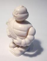 Full Length Still Life of Wind Up Plastic Bebbendum Michelin Man Mascot Toy in Studio with White Background