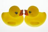 Still Life of Pair of Yellow Rubber Ducks Facing Each Other on White Background - Two Yellow Duck Tub Toys Mirroring Each Other in Studio