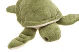 Close up of fluffy green stuffed animal turtle on isolated white background
