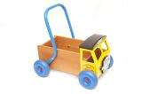 Colorful kids toy walker truck with a metal handle to push it along isolated on a white background