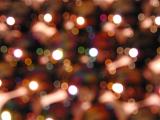 background of repeating bokeh shapes with coppery warm tone