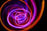 chaotic spiral of orange red and purple lines emoting a sense of energy