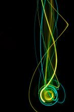 a dynamic background of falling streaking lights in green and cyan tints