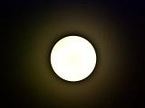 a round white bulkhead ceiling light