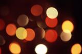 warm coloured diffuse background of amber and rellow glowing bokeh circles