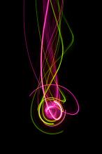 pink and green lightpainted pattern with overlapping light wave and curves