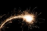 a shooting fireball of hot sparks with a trail behind