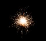 a glowing burst of sparks with a bright central point