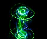 a spiraling light painting with dynamic traces of vivid green and blue light