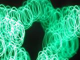 green swirls of light with space for text in the centre