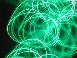 overlapping swirls of green light showing depth