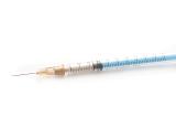High Angle View of Small Syringe Filled with Dose of Injectable White Medication Isolated on White Background