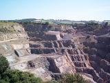 Landscape view of stepped terraces in an open cast rural quarry mining natural resources and rock