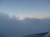 view from an aeroplane window flying into clouds