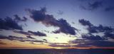 Panoramic Overview of Dramatic Horizon Landscape Underneath Tranquil Cloudy Sky at Sunset