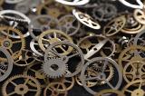 macro images of tiny gear wheels or cogs from a watch or clock