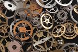 an assrotment of gears and wheels from a clockmakers parts box