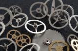 a collection of clock and watchmakers flywheels and gears