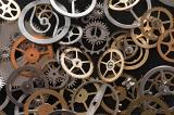 a macro image of small gear wheels and parts from mechanical watches