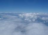 floating above fluffy white clouds