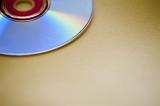 an audio cd resting on a yellow background