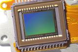 CMOS image video sensor chip close-up green and blue gradient on the matrix