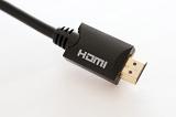 Multimedia HDMI plug closeup over a white background viewed from above in an entertainment concept with copy space