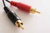 A pair of stereo phono connector cables in black and red colours