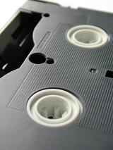 Close up detail of an old VHS video cassette tape in a communication and entertainment concept