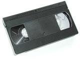 Old black plastic video cassette tape with no label isolated on white in an entertainment and communication concept