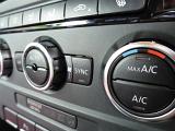 Air conditioning control dial on the dashboard in a car in a close up selective focus view