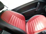 Crop black and red leather seat in modern sportive car.