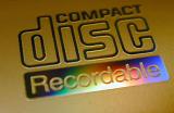 Recordable compact disc lable close-up on yellow CD surface