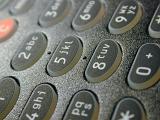 sideways view of a telephone numbered dial keypad