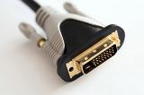 Black, white and gold plated male end DVI connector close up over white background