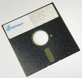 Old 5 and 1/4  inche diskette with label against white background
