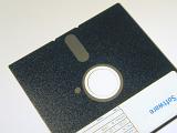 Old floppy disk, a flexible removable magnetic disk that stores data for use in a microprocessor on a computer isolated on white