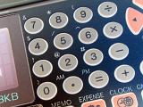 Close up of an old style, retro computer organiser keypad and calculator buttons.
