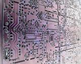 Abstract close up of the circuitry within a large, complex purple electronic motherboard.