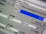 Photoshop processing scanner progress bar at 57 percent